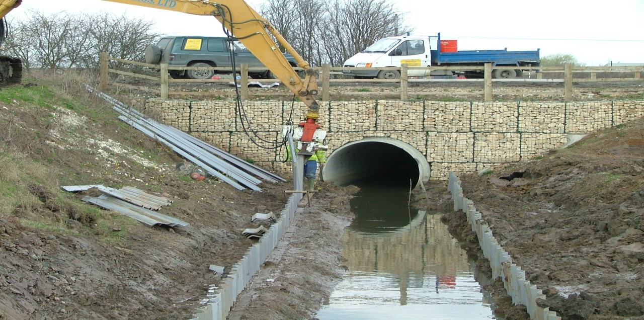 Sheet piling works beside a watercourse