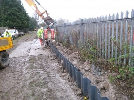 Excavator undertaking watercourse maintenance