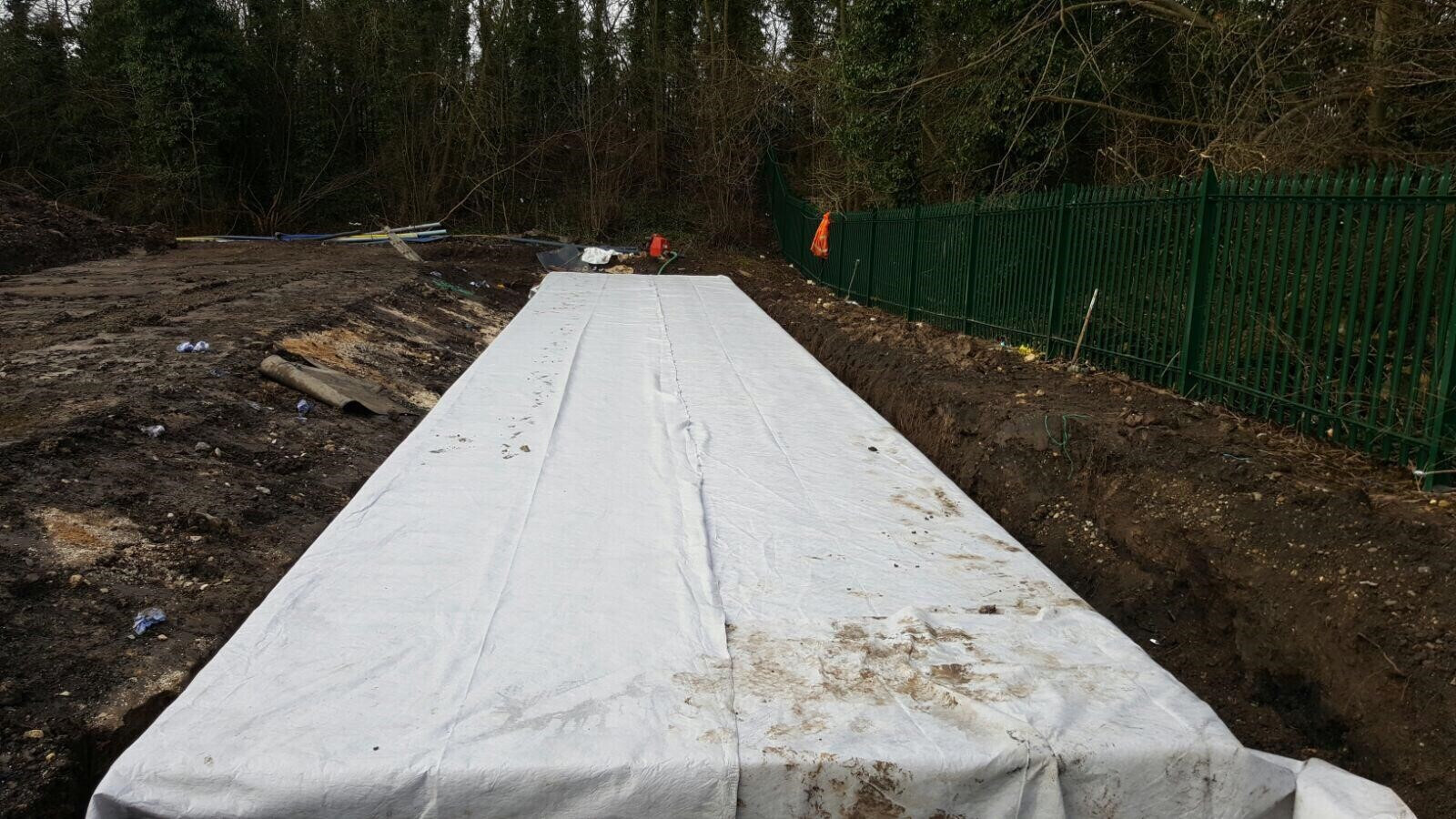 Protection layer installed within the SuDS excavation
