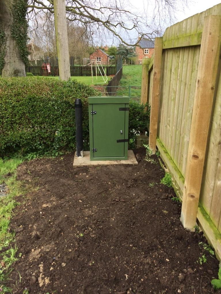 Domestic treatment plant installation beside a property