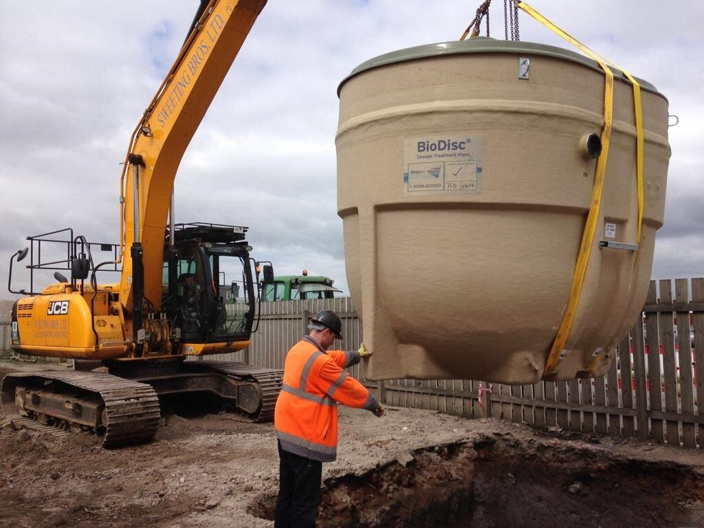 Treatment tank being lifted into place