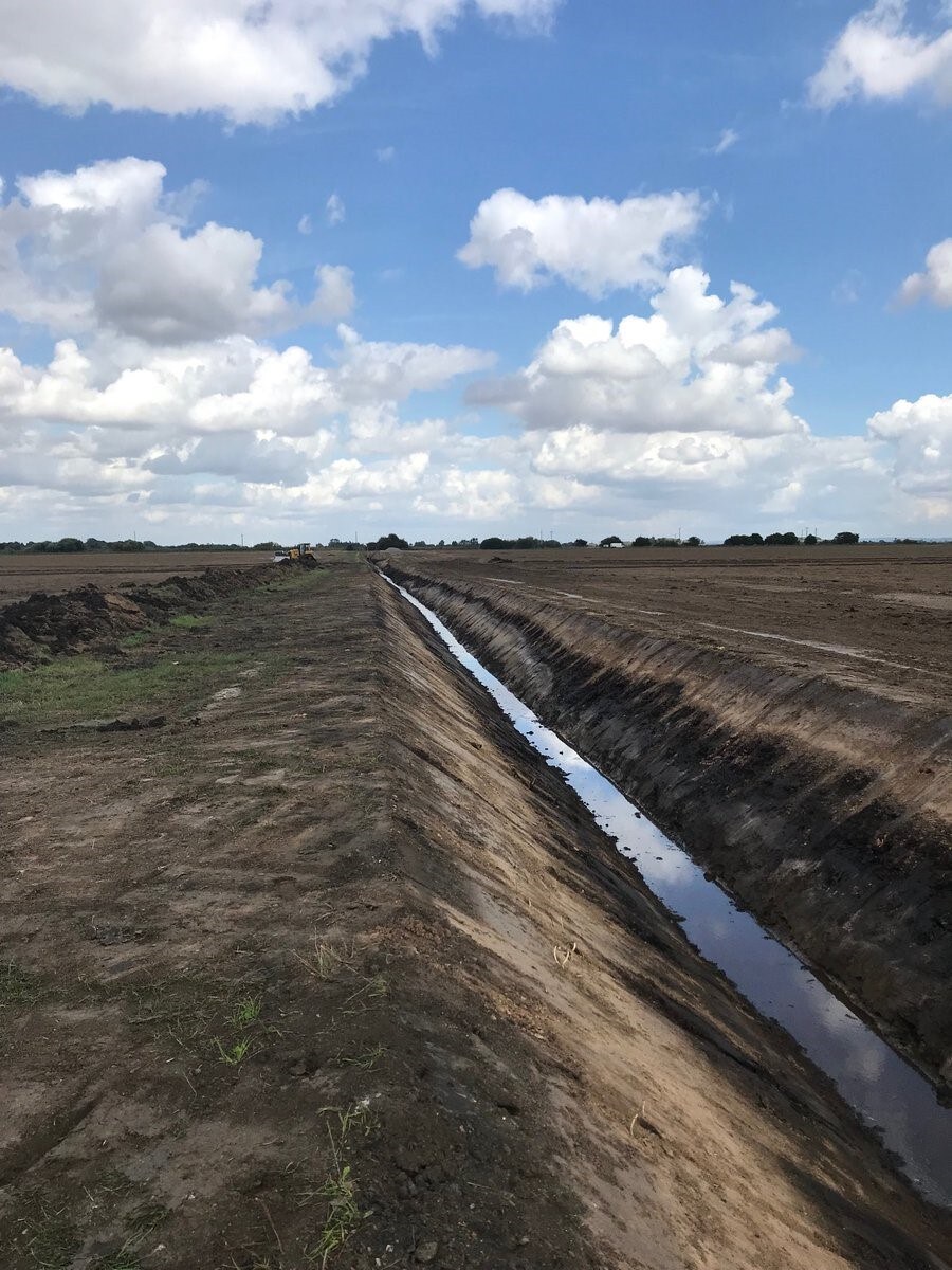 Re-profiled watercourse channel in open farmland